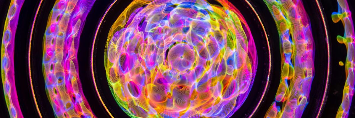 Symmetric neon pattern representing community balance